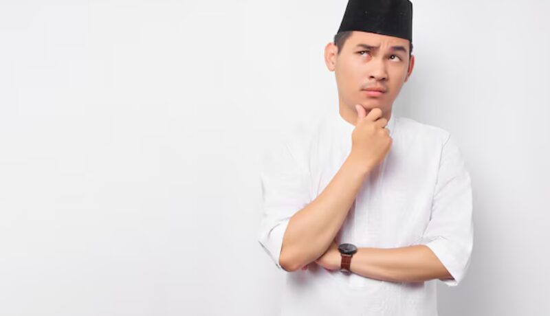 portrait-pensive-young-asian-muslim-man-looking-empty-space-touching-his-chin-thinking-about-offer-isolated-white-background-people-religious-islamic-lifestyle-concept_509243-8329